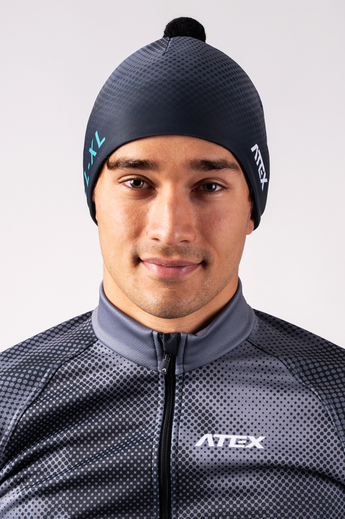 Sports cap with two layers and pompom